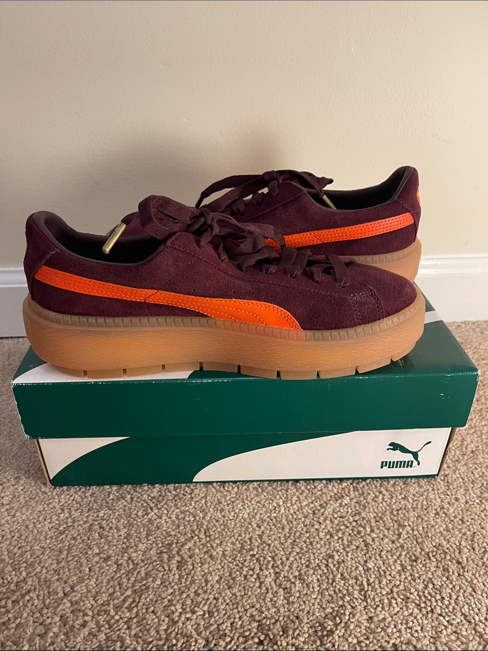 PUMA Woman’s Burgundy Suede Sneakers with Orange Accent